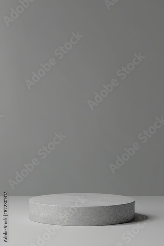 Grey podium displayed on matching background in minimalistic 3D design concept
