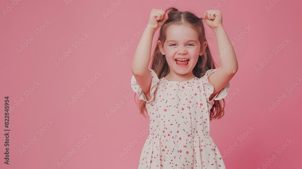 Full size photo of cute young girl raise fists wear dress isolated on pink color background  