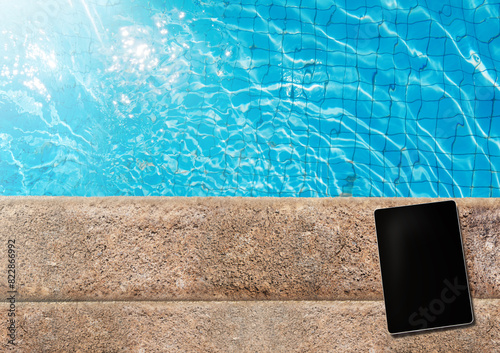 Tablet with copy space on the side of the pool