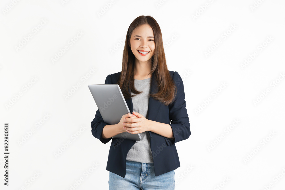 Cheerful beautiful Asian woman holding laptop and looking forward on white background. Cheerful beautiful Asian woman holding laptop and looking forward on white background.