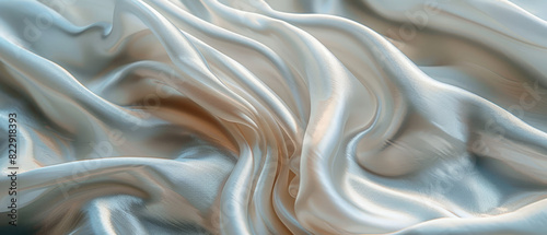 Wavy silk fabric with a shiny metallic texture creates a luxurious backdrop