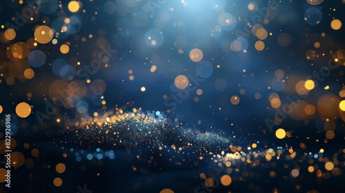 Golden Christmas lights and bokeh on a rich dark blue abstract background