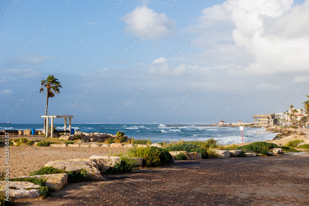 Fototapeta premium Sandy beach in Haifa, Israel. with a stunning beach and turquoise water. Summer mood.