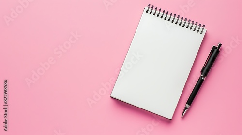 Blank notebook with spiral for the application of labels and pen on pink background. Top view. Generative Ai