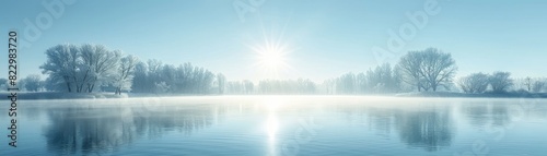 Misty lake at dawn, with an isolated light blue background, providing copy space on the right side photo