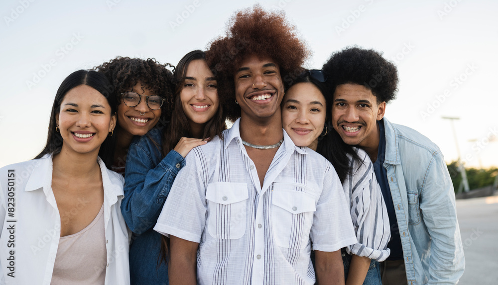 Diverse Group of Young Adults Smiling Together Outdoors Diverse Group of Young Adults Smiling Together Outdoors
