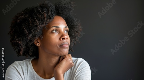  A tight shot of a woman in a white shirt, her gaze fixed off-camera, conveying a serious expression