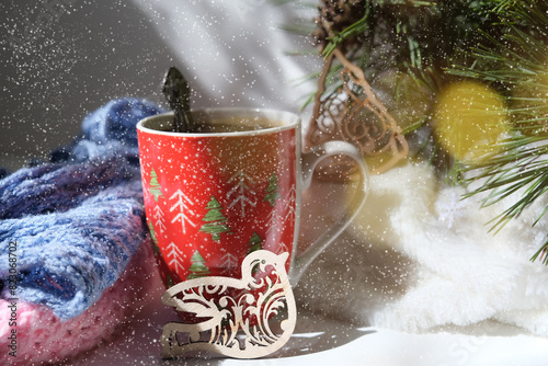 Christmas tree and decorations toys, Cup of coffee or hot chocolate. Cozy home. Christmas atmospheric mood. Happy New Year