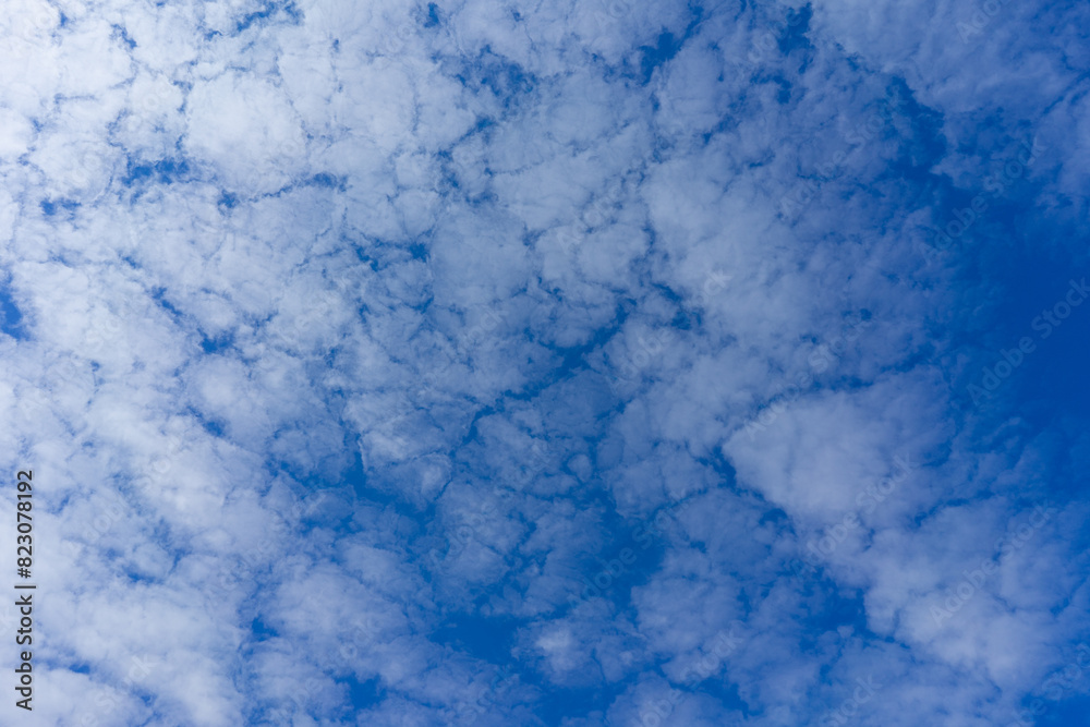 Blue sky with fluffy clouds, texture background Blue sky with fluffy clouds, texture background