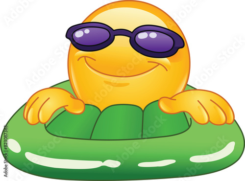 Happy Emoji Emoticon with Sunglasses on a Green Inflatable Pool or Sea Water Mattress