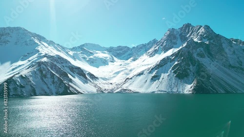 El Yeso reservoir covered with snow, Cajon del Maipo, country of Chile photo