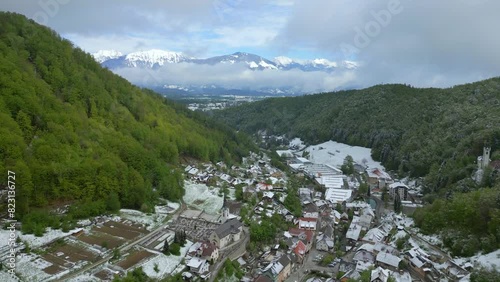 Aerial view of the village in the valley below the Slovenian mountain massifs photo