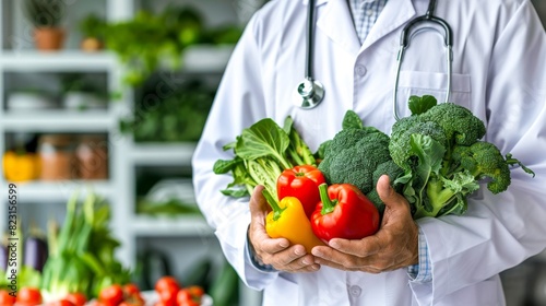 The doctor is holding a variety of fresh vegetables.