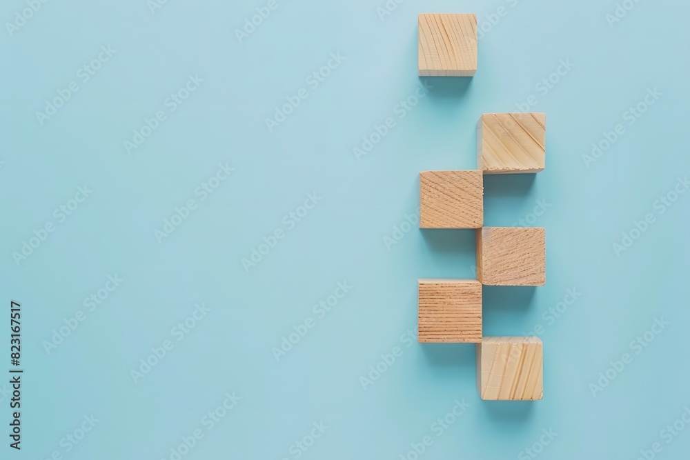 Concept of Idea and Innovation with Wooden Block Steps on Light Blue Background Concept of Idea and Innovation with Wooden Block Steps on Light Blue Background