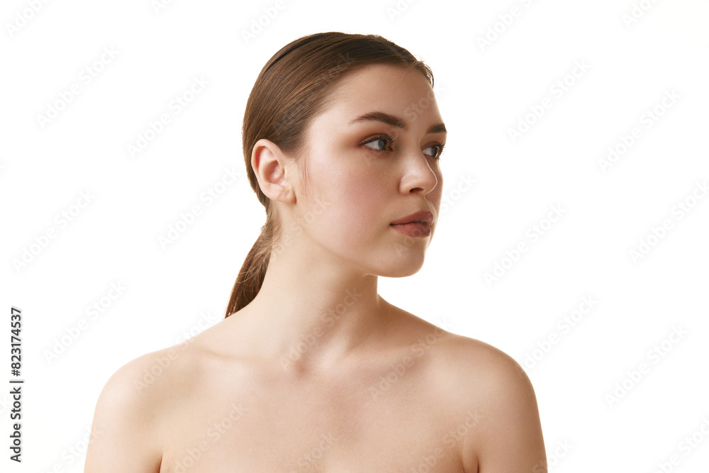 Beautiful brunette girl with neutral make up calmly looking away against white studio background. Copy space. Concept of natural beauty, antiaging treatment, wellness, youth. Ad Beautiful brunette girl with neutral make up calmly looking away against white studio background. Copy space. Concept of natural beauty, antiaging treatment, wellness, youth. Ad