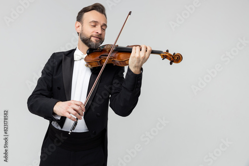 Bearded man artistic violinist performing