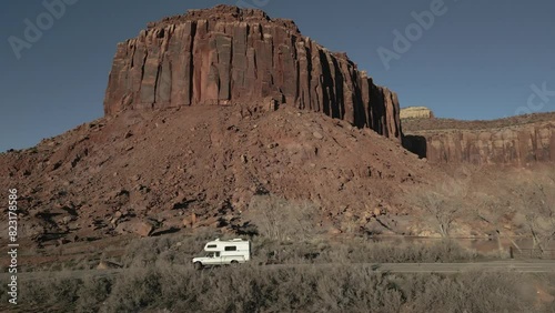 Camper driving on Park Highway in Indian Creek Climbing area in Utah, USA photo