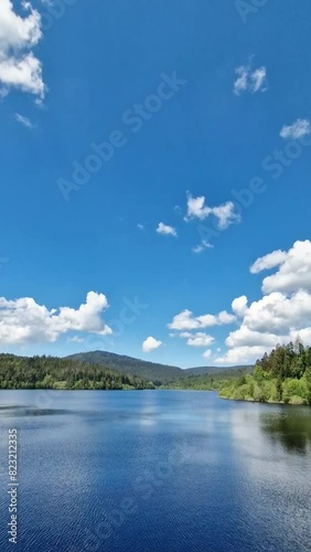 clouds over the lake river water landscape naturein summer photo