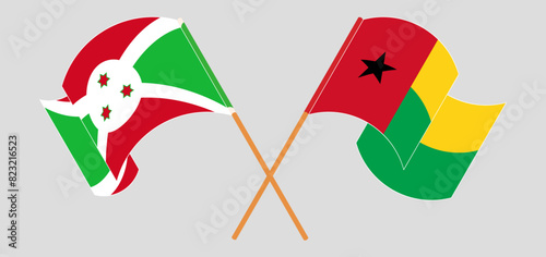 Crossed and waving flags of Burundi and Guinea-Bissau photo
