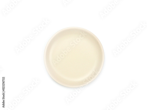 Top view, empty beige round ceramic plate isolated on a white background. Use for home or restaurant, food design. Kitchen accessory. .