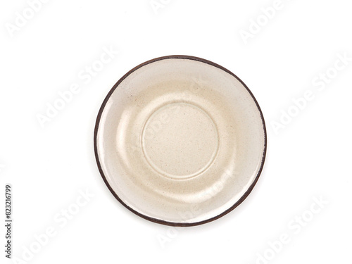 Top view, empty beige round ceramic plate with brown rim isolated on a white background. Use for home or restaurant, food design. Kitchen accessory. ..