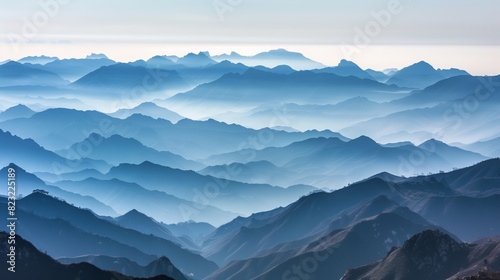 A panoramic view captures mountain ranges fading into mist  creating a breathtaking  ethereal landscape.