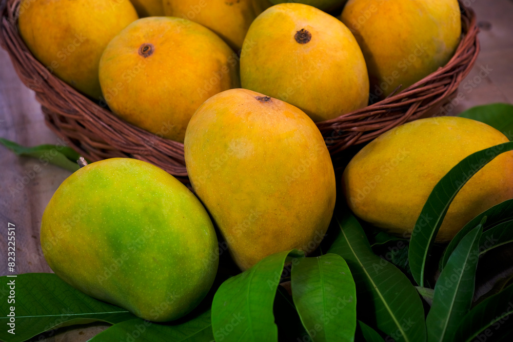 Fresh Mango tropical fruit with green leaf, Ripe mango in grass. Fresh Mango tropical fruit with green leaf, Ripe mango in grass.