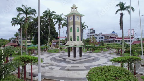 Fly over the passages towards the center of Puerto Maldonado. Discover the imposing obelisk and charming Japanese clock from the air photo