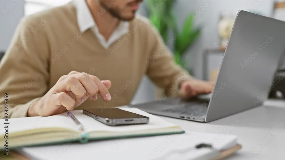 Handsome hispanic man working on laptop in modern office, professional adult employee indoors Handsome hispanic man working on laptop in modern office, professional adult employee indoors