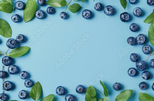 Blueberries With Leaves on a Blue Background
