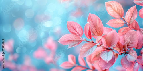 Pink Leaves Against a Blue Bokeh Background. Close-up of delicate pink leaves with a dreamy blue bokeh background  creating a serene and enchanting scene.