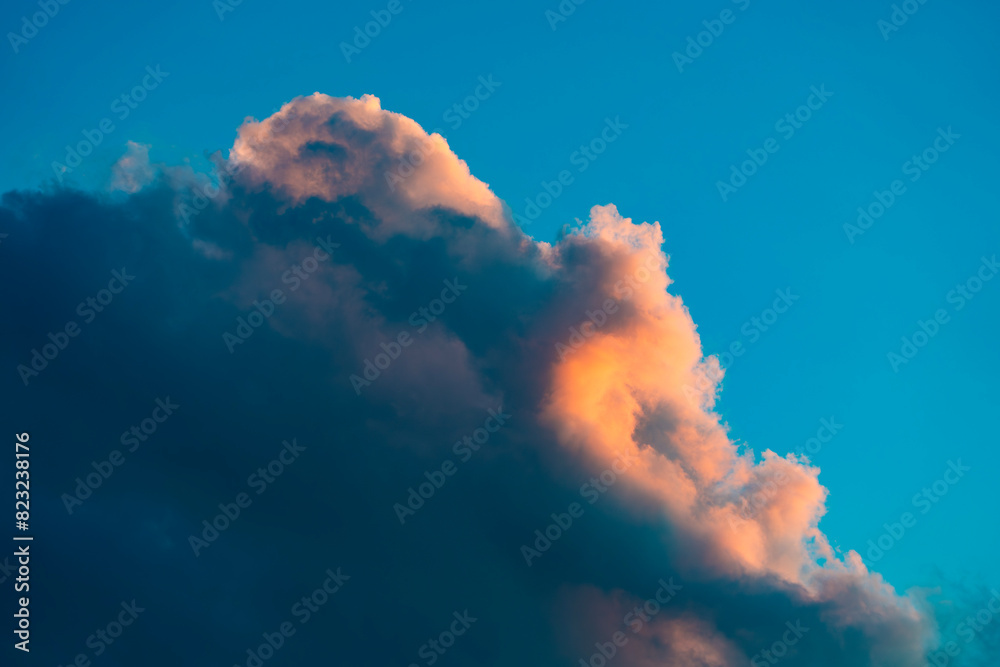 A stunning display of dramatic clouds illuminated by the vibrant colors of a sunset, showcasing the beauty and complexity of nature's evening skies. Perfect for backgrounds and atmospheric scenes. A stunning display of dramatic clouds illuminated by the vibrant colors of a sunset, showcasing the beauty and complexity of nature's evening skies. Perfect for backgrounds and atmospheric scenes.