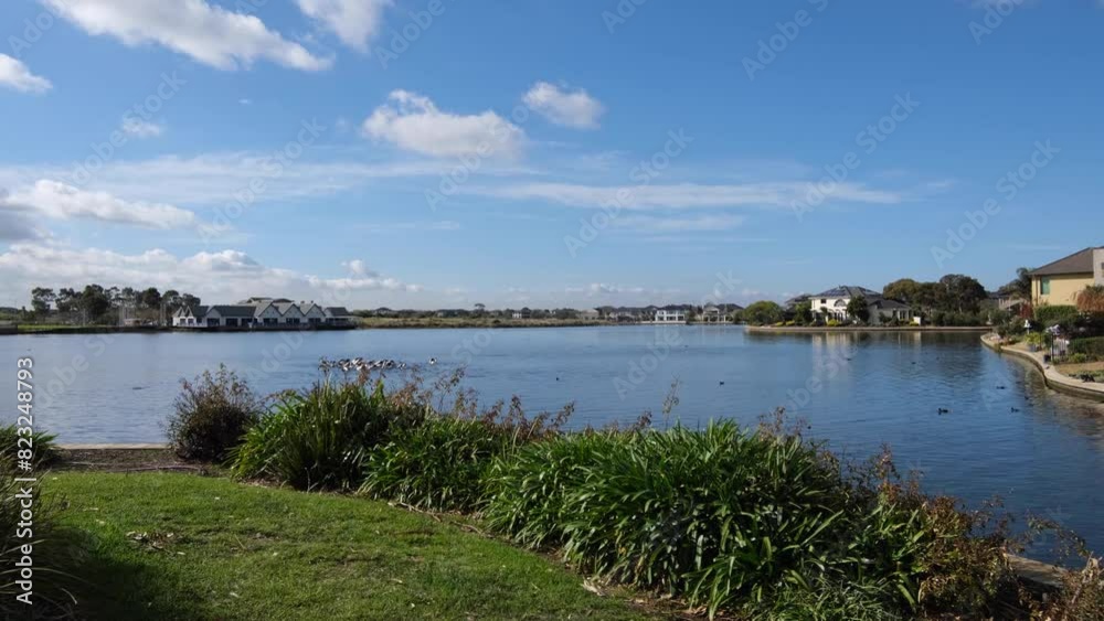 Beautiful scenery at the waterfront of Sanctuary Lakes, with luxury houses and Australian suburban homes in the distance. Point Cook, Melbourne, Australia. Beautiful scenery at the waterfront of Sanctuary Lakes, with luxury houses and Australian suburban homes in the distance. Point Cook, Melbourne, Australia.