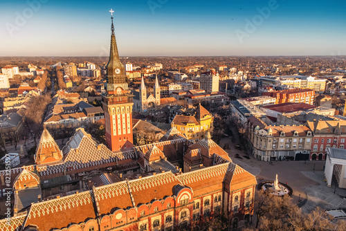 Aerial view of a famous Subotica town hall as a symbol of the city history and architectural heritage, with its red facade and elegant clock tower drawing visitors and tourists to Serbia photo