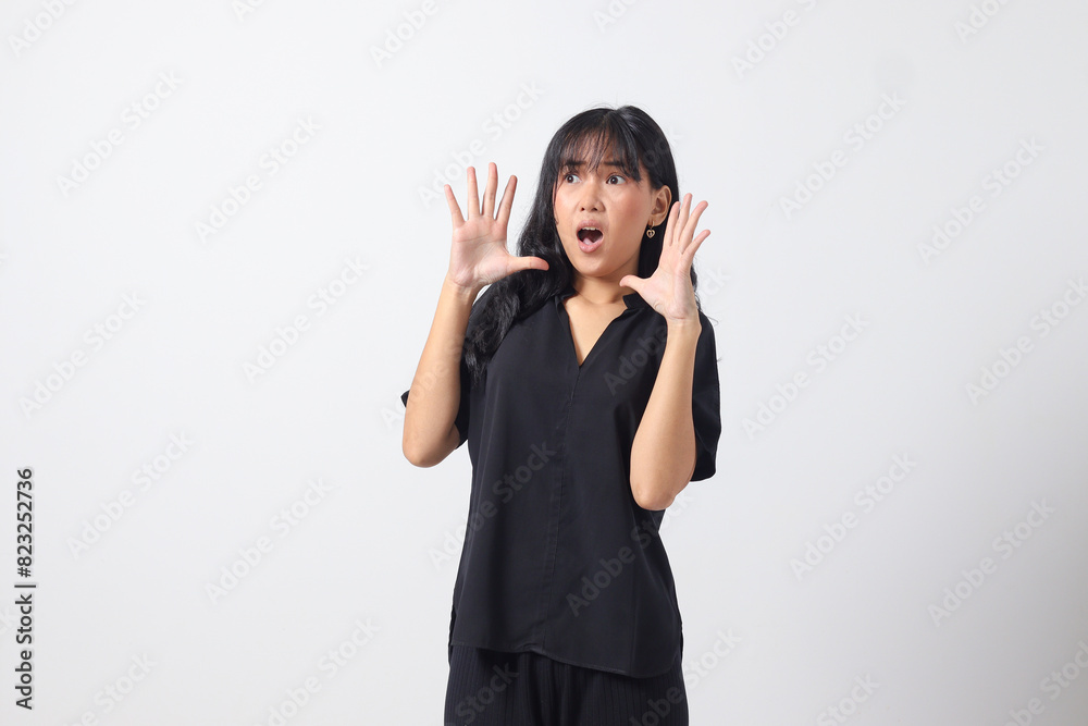 Portrait of attractive Asian woman in casual shirt shouting to the distance, announcing discount and promotion. Businesswoman concept. Isolated image on white background Portrait of attractive Asian woman in casual shirt shouting to the distance, announcing discount and promotion. Businesswoman concept. Isolated image on white background