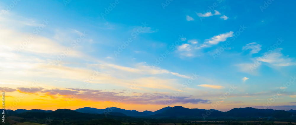 Sunset Sky over the mountain as Twilight in the Evening as the colors of Sunset Horizon scene