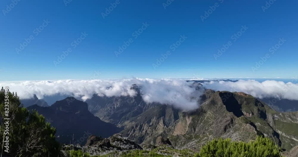 Time lapse of clouds flowing over the mountain range on a sunny day on an island. Time lapse of clouds flowing over the mountain range on a sunny day on an island.