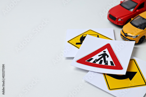 Traffic signs and vehicles on a white background.