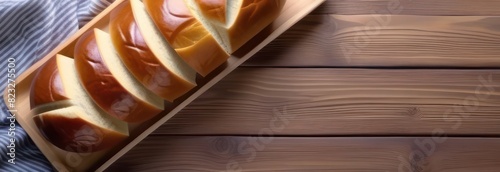 	 Banner Fresh bread on a light wooden table, there is space for text, top view 