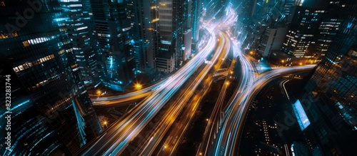 Illuminated Cityscape at Night - A dazzling display of urban life, bustling streets, and towering buildings bathed in warm light.