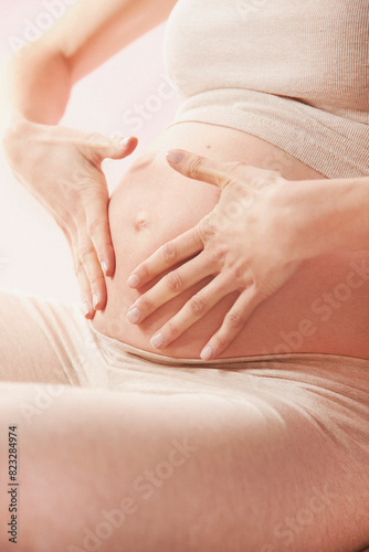 Effleurage Therapeutic Massage, Pregnant Woman Massaging her Stomach
 photo
