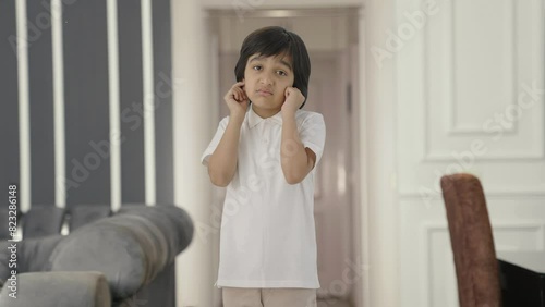 Guilty Indian boy saying sorry and apologizing