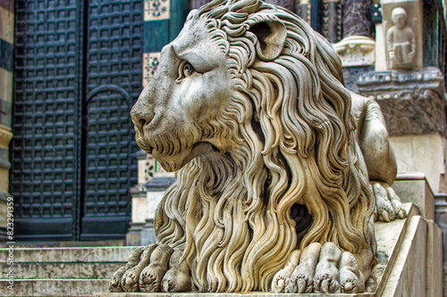 Lion sculpture in front of Genoa Cathedral or Metropolitan Cathedral of Saint Lawrence in Genoa, Italy.