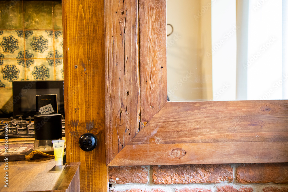 wooden door open in the kitchen with a brick wall behind wooden door open in the kitchen with a brick wall behind