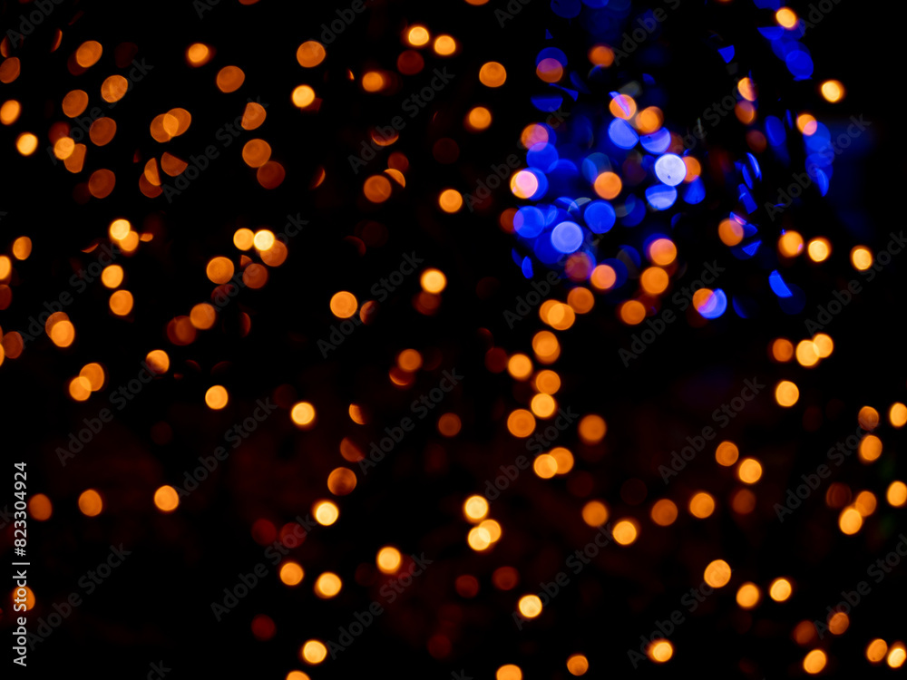 abstract blurred bokeh background, bright lights on a black background abstract blurred bokeh background, bright lights on a black background