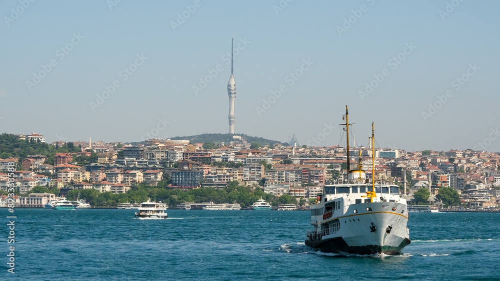 Fototapeta premium Passenger ship on the sea with Televisin Tower, buildings in İstanbul. Open space area. Selective focused.