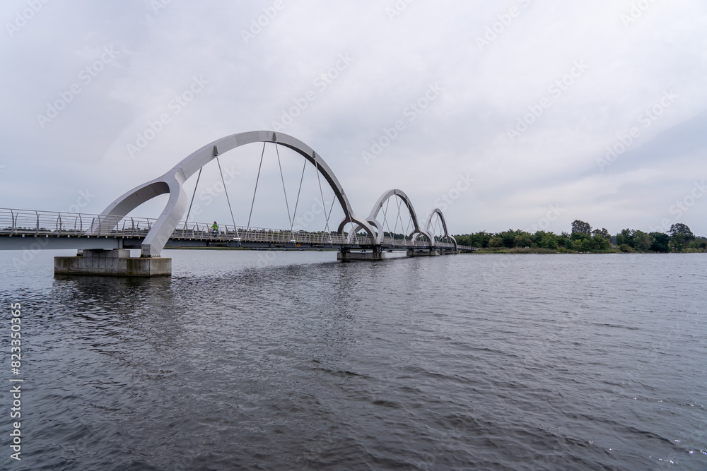 Fototapeta premium Steel rail bridge crossing waterway, Sweden, Soelvesborg