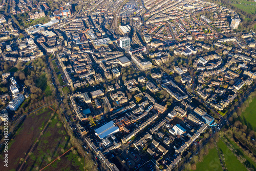 Aerial photo of the town centre of Harrogate in the UK showing a muddy playing field known as the west park stray slammed as an environmental disaster after cars ruined the fields in the winter © Duncan