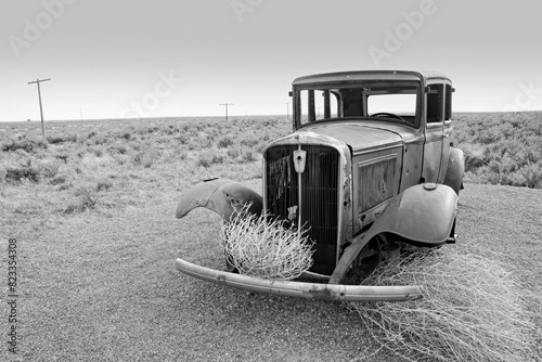 Old abandoned car on Route 66 in the Arizona desert. . Left over from the 1930's dust bowl route to California.