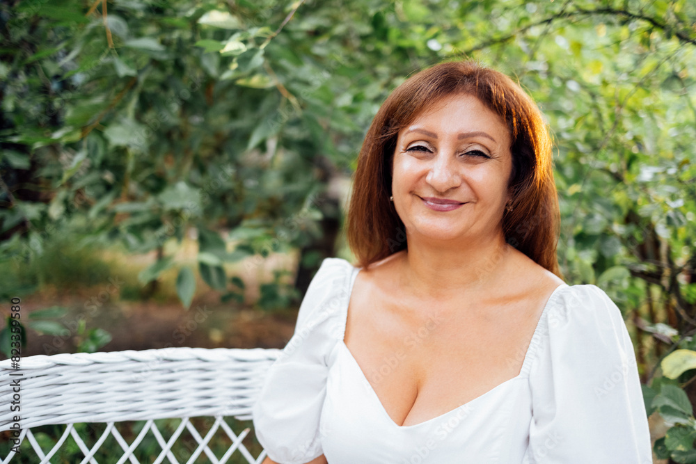 Smiling middle aged caucasian woman looking at the camera and posing. Smiling middle aged caucasian woman looking at the camera and posing.